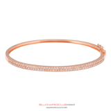 All of the VS diamonds are hand-set by a master diamond setter in the highest quality craftsmanship. This piece is made of solid gold. Our handcrafted Gold Double Row Diamond Bangle contain famous designs seen on various entertainers and celebrities around the world.